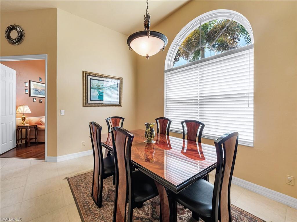 Dining space featuring baseboards and light tile patterned floors