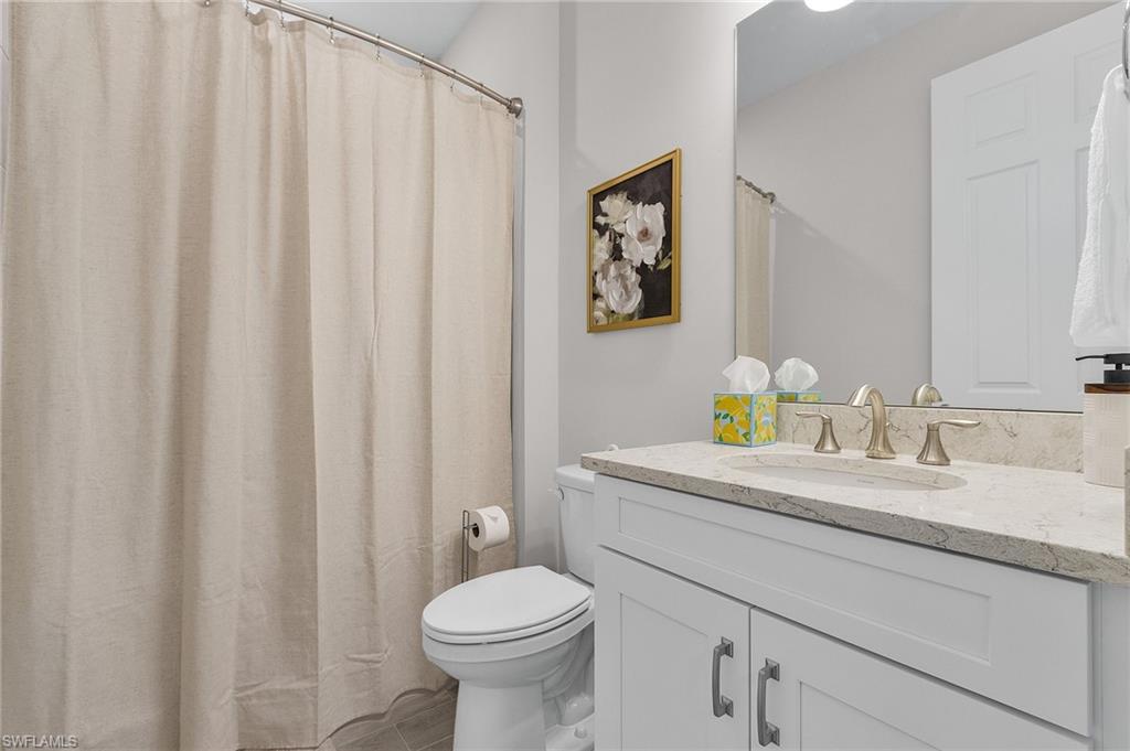 Bathroom with vanity and toilet
