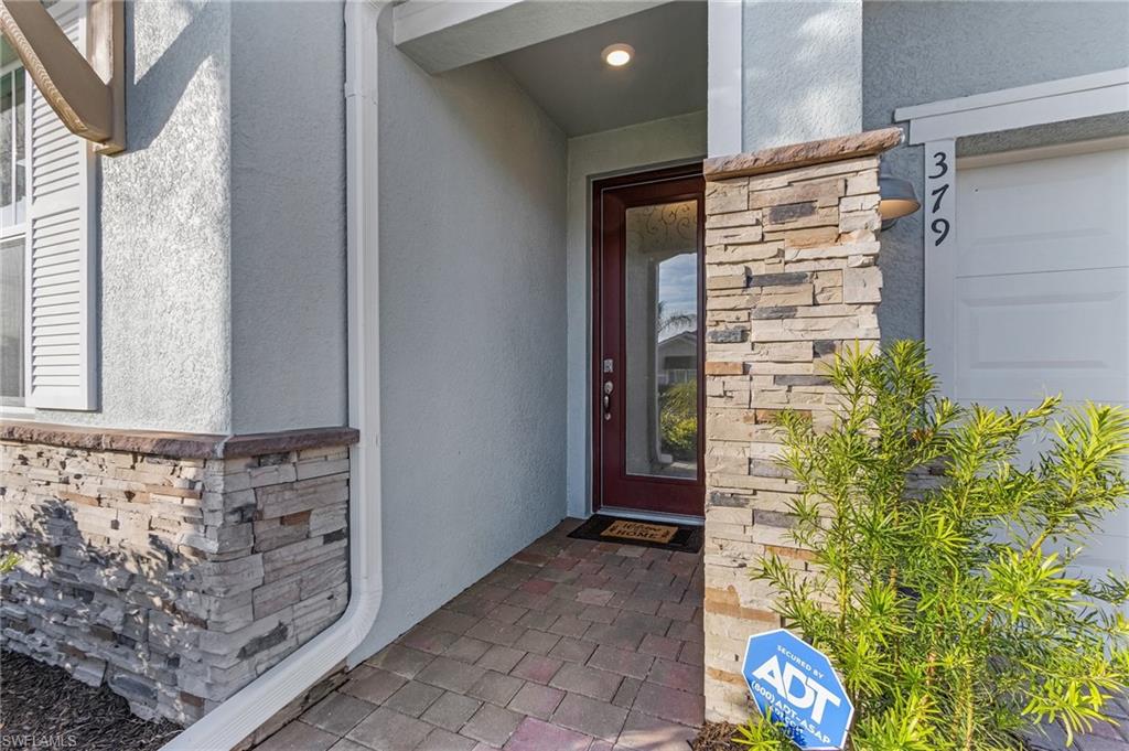 Entrance to property with a garage
