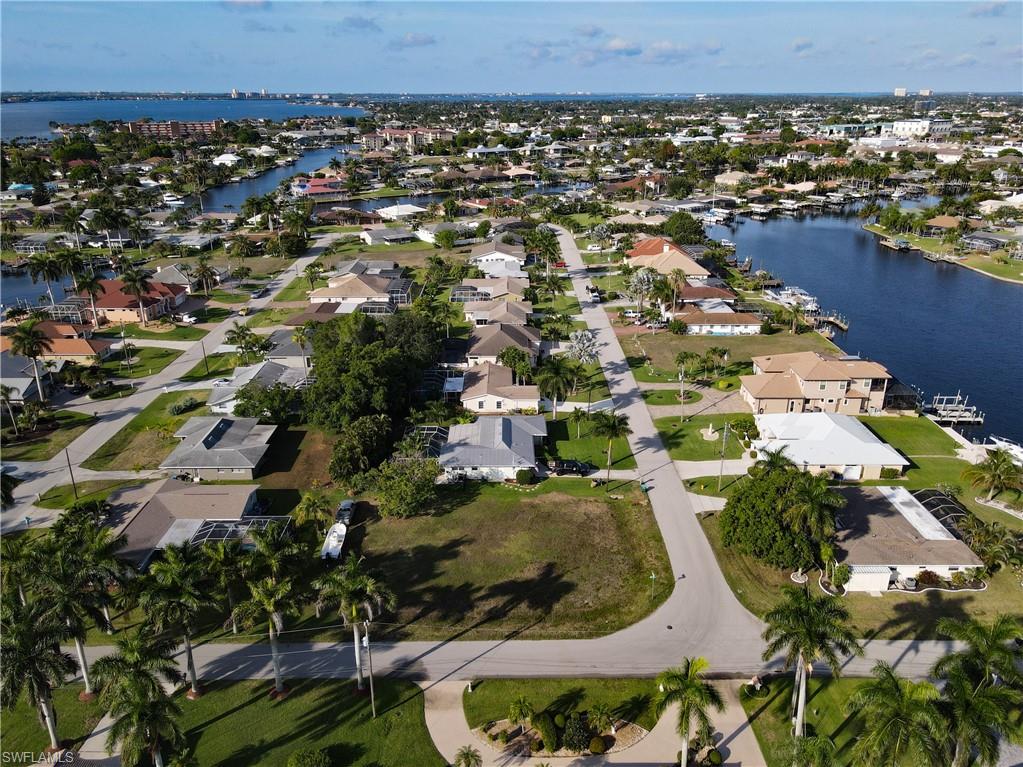 Aerial overview of property's location featuring nearby suburban area and a large body of water