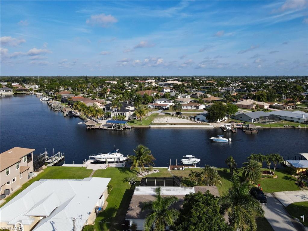 Aerial perspective of suburban area with a nearby body of water
