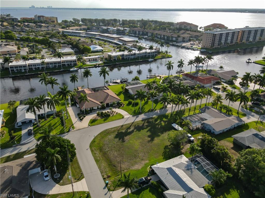Aerial view of residential area featuring a large body of water