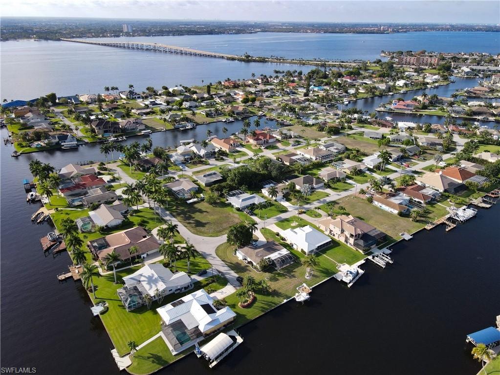 Aerial overview of property's location with nearby suburban area, a nearby body of water, and a notable bridge