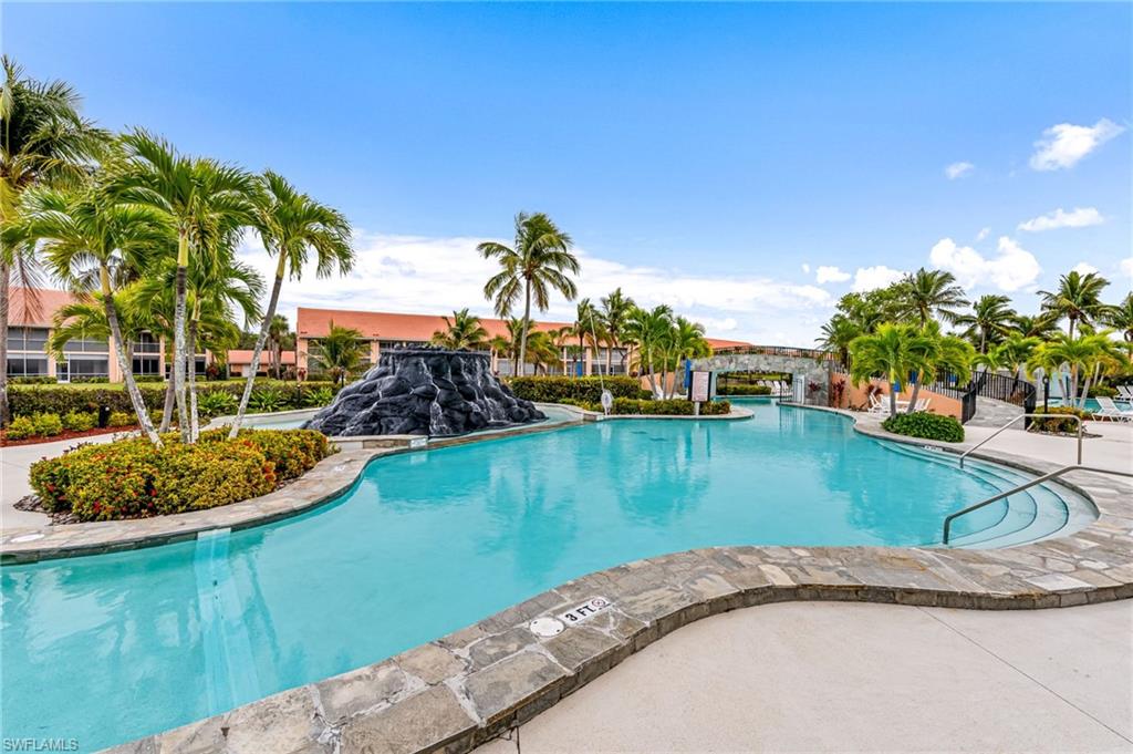 Community pool featuring a patio