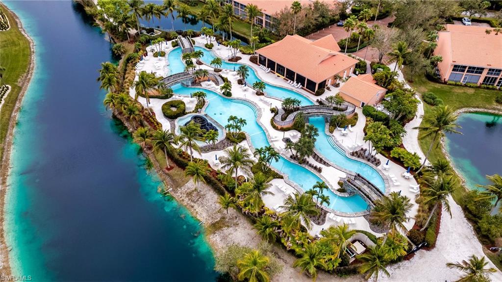 Aerial view of a nearby body of water and a pool