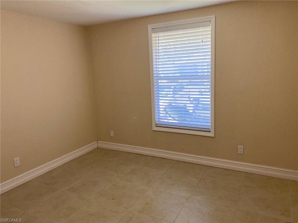 Spare room featuring baseboards