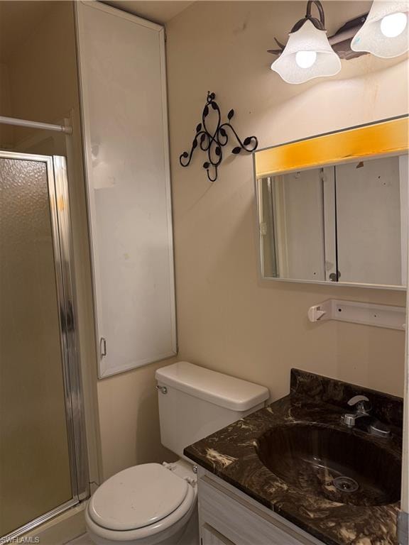Bathroom featuring vanity and a stall shower