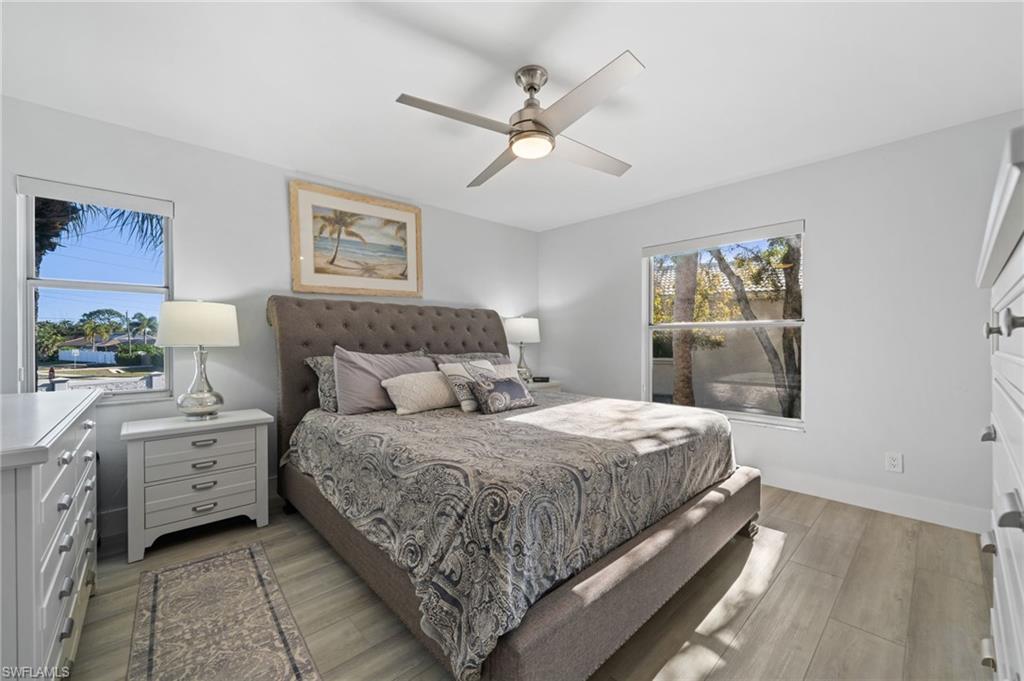 Bedroom featuring light wood-type flooring and a ceiling fan