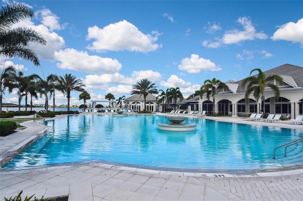 Community pool with a patio