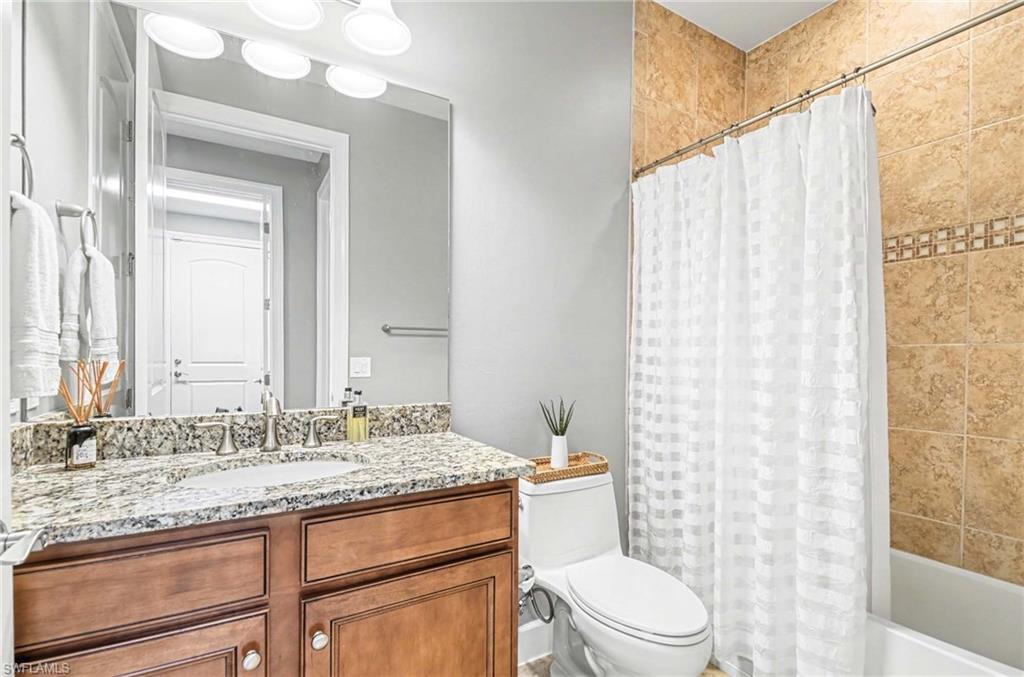Bathroom with vanity and shower / bath combo