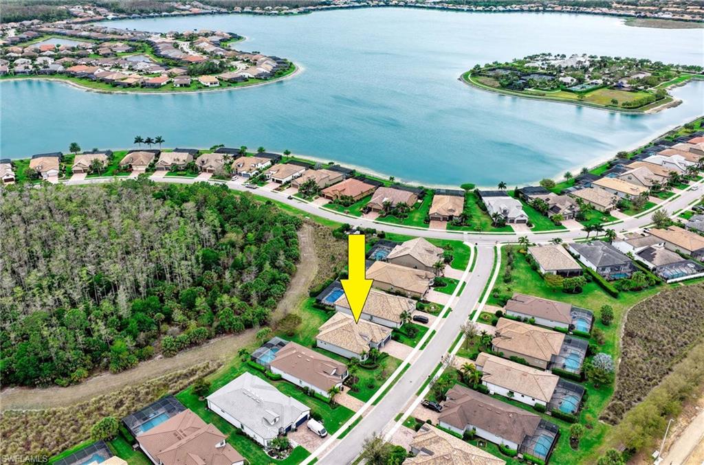 Aerial view of residential area with a nearby body of water
