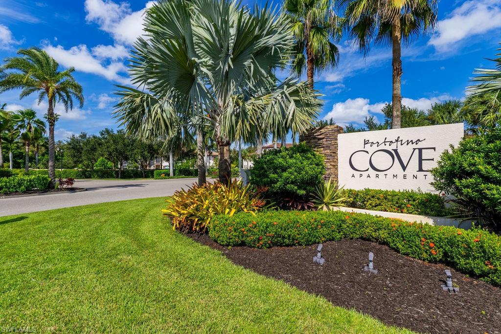 Community sign featuring a lawn