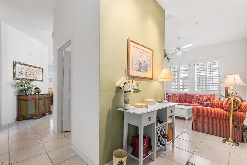 At the landing, right to sitting area and kitchen or guest Guest Bedroom 2 and guest bath. To the left is Guest Bedroom 1. Laundry room door is open. Full sized washer and dryer plus laundry sink.