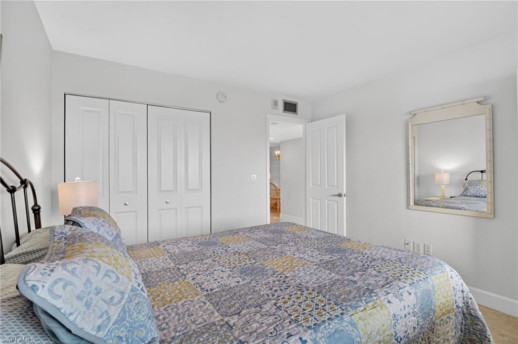 Bedroom with carpet and a closet