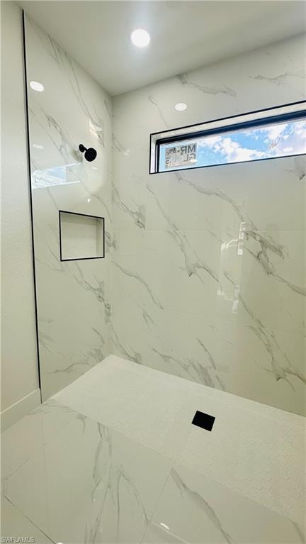 Full bathroom with a marble finish shower, recessed lighting, and marble finish floors
