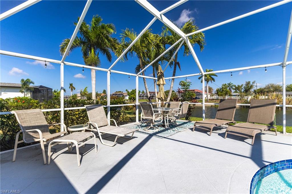 View of patio featuring a lanai and a sunroom