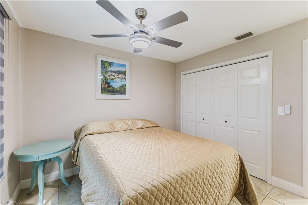 Bedroom featuring a closet and ceiling fan