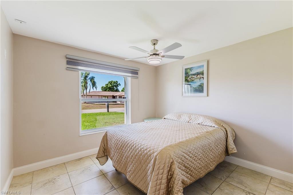 Bedroom with baseboards and a ceiling fan