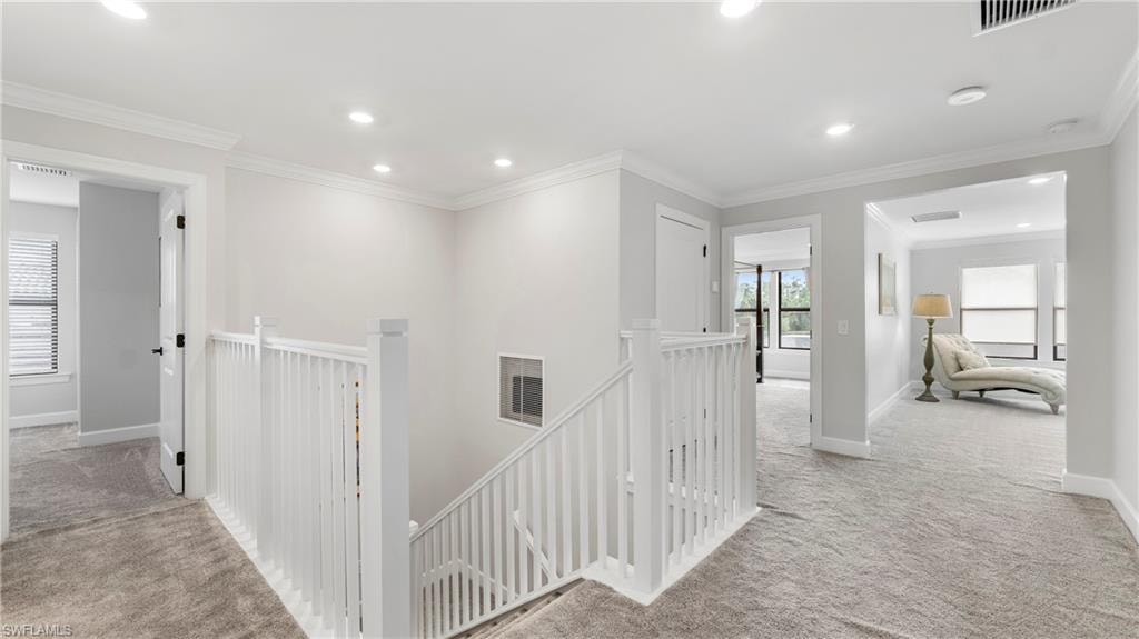 Upstairs Hallway leading to all bedrooms, full hall bath and Laundry Room