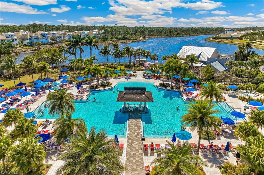 Bird's eye view of a pool area and a large body of water