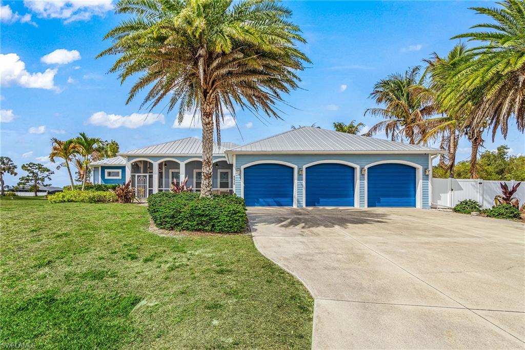 4438 NE 11th Place,Cape Coral FL 339095 Plus Car Garage, 8300 lb lift, .41 acres on corner fenced lot.