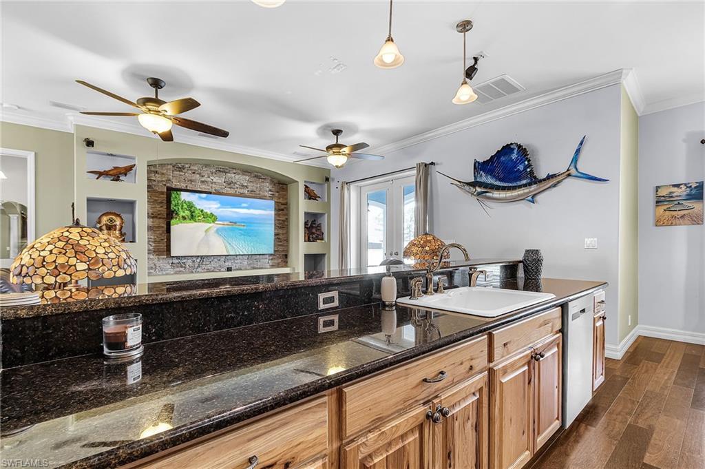 new stainless-steel appliances, propane stove/cooktop, granite countertops, breakfast bar, and beautiful solid wood cabinets