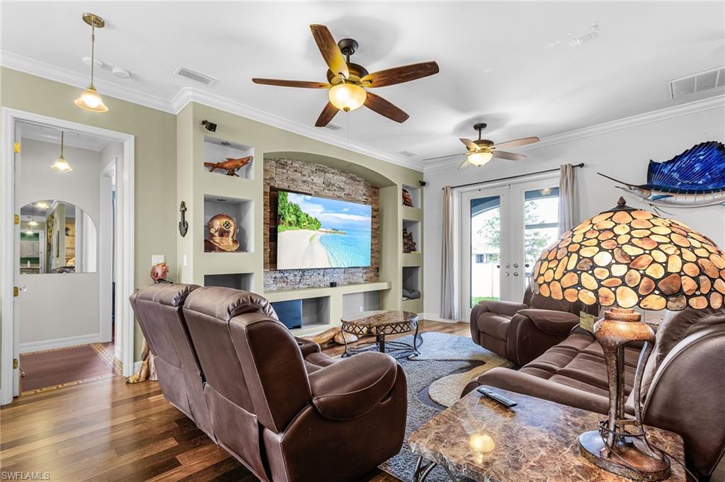 large entertainment built-ins, french doors to back patio