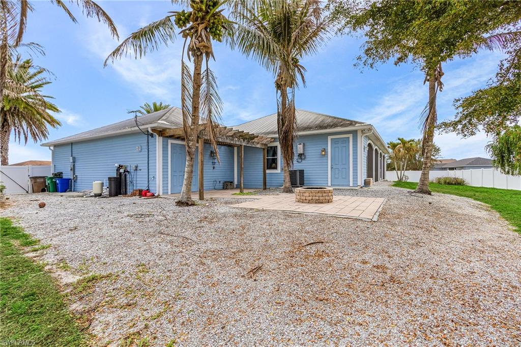 space for boat and RV parking, 2 large RV gates, fire pit, outdoor storage room.