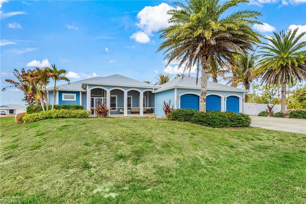 4438 NE 11th Place,Cape Coral FL 339095 Plus Car Garage, 8300 lb lift, .41 acres on corner fenced lot.