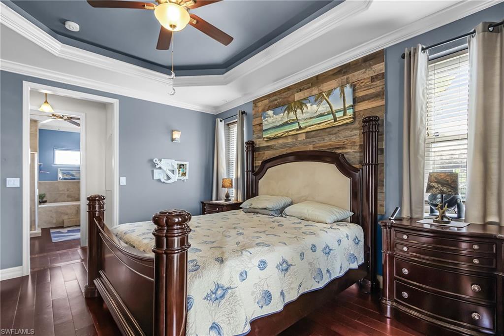 Large primary suite with doors to screened back lanai