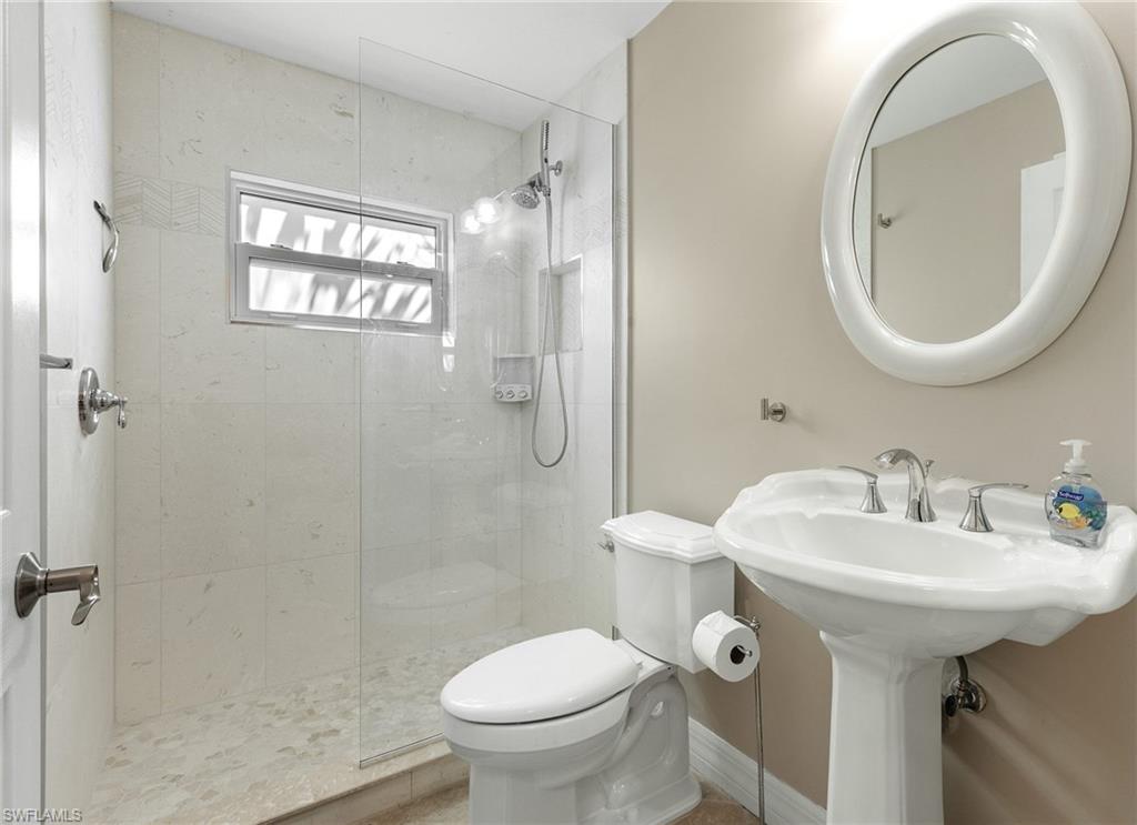 Bathroom featuring walk in shower and tile patterned floors