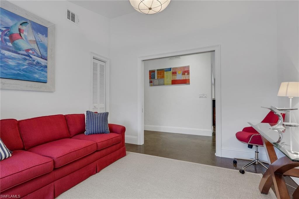 Third Bedroom/Den featuring baseboards, polished concrete floors, double pocket doors and closet