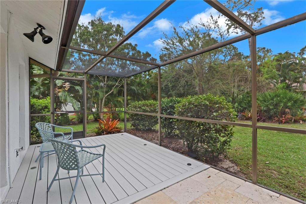 Screened Lanai looking into yard just off the guest bath