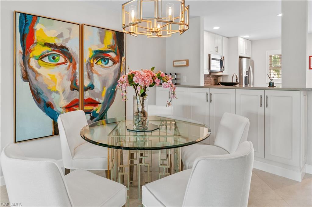 Dining space featuring a chandelier and light tile patterned floors