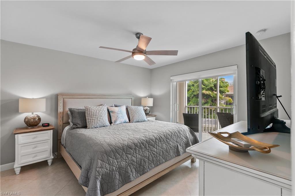 Bedroom featuring ceiling fan, access to outside, and light tile patterned floors