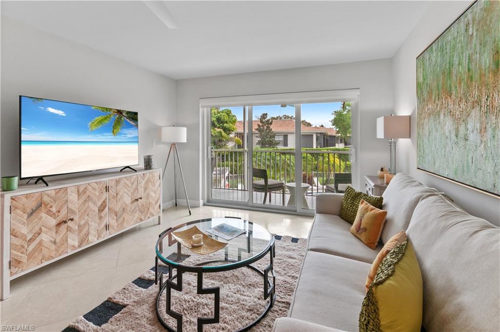 Living room with light tile patterned floors and baseboards