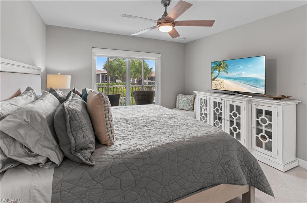 Bedroom with a ceiling fan and access to exterior