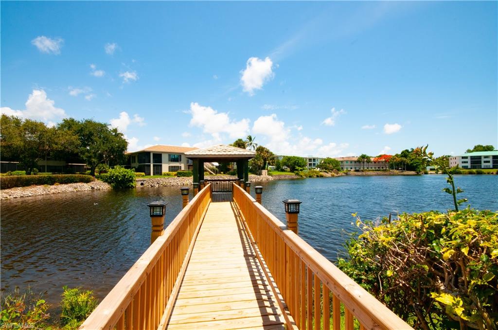 Dock area with a gazebo and a water view