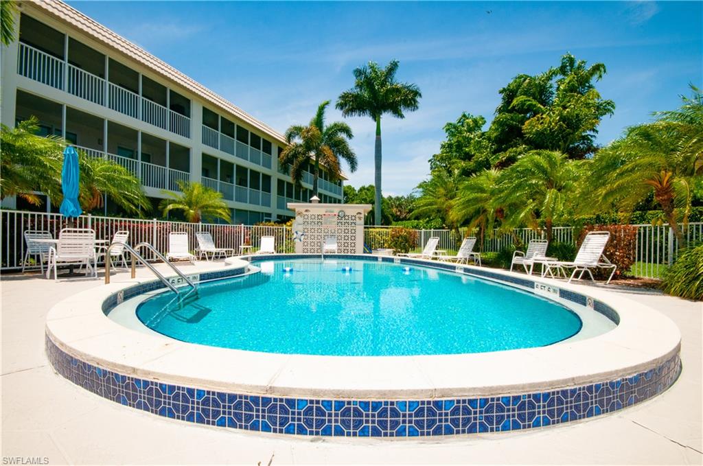 Community pool with a patio