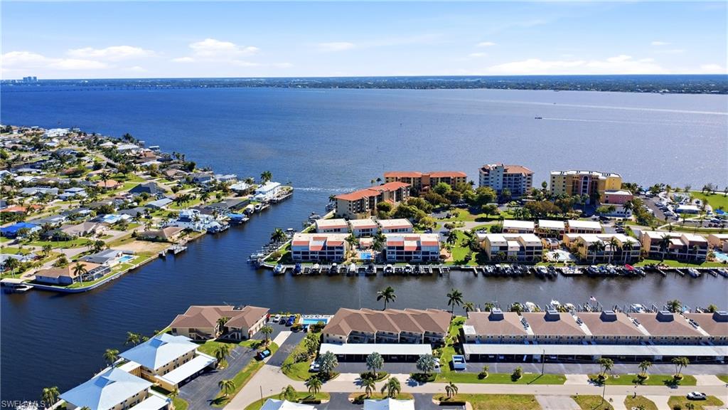 Aerial overview of property's location featuring a large body of water