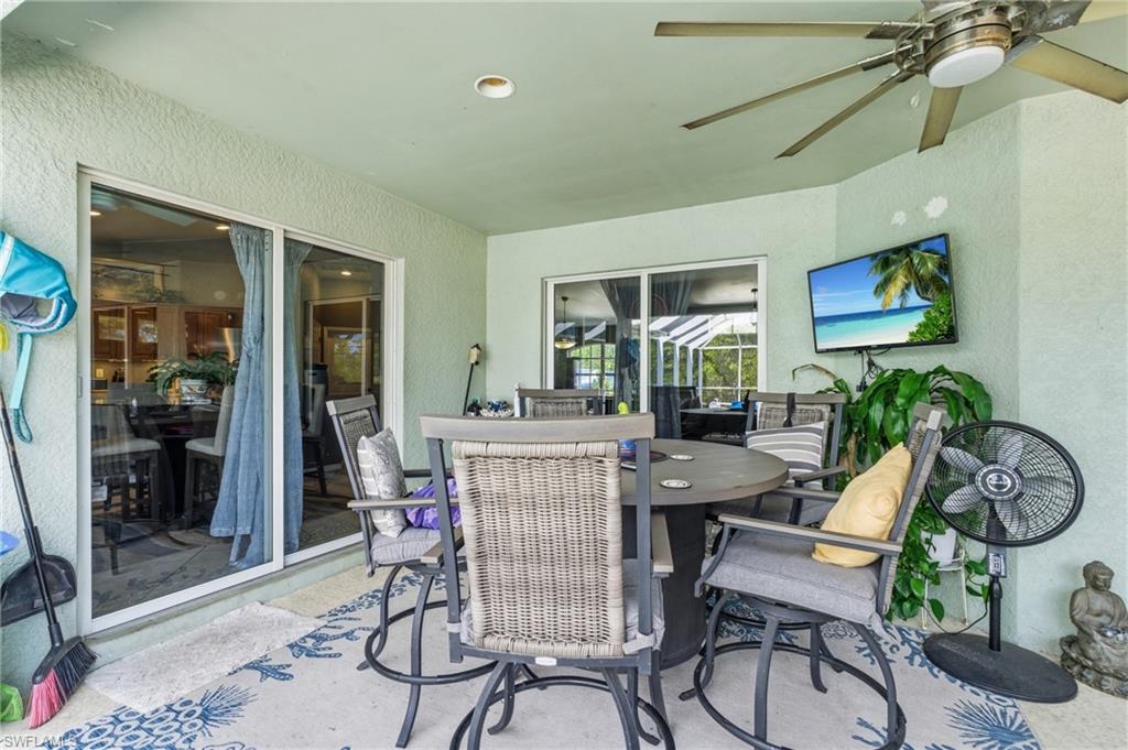 View of patio / terrace with a ceiling fan and outdoor dining area