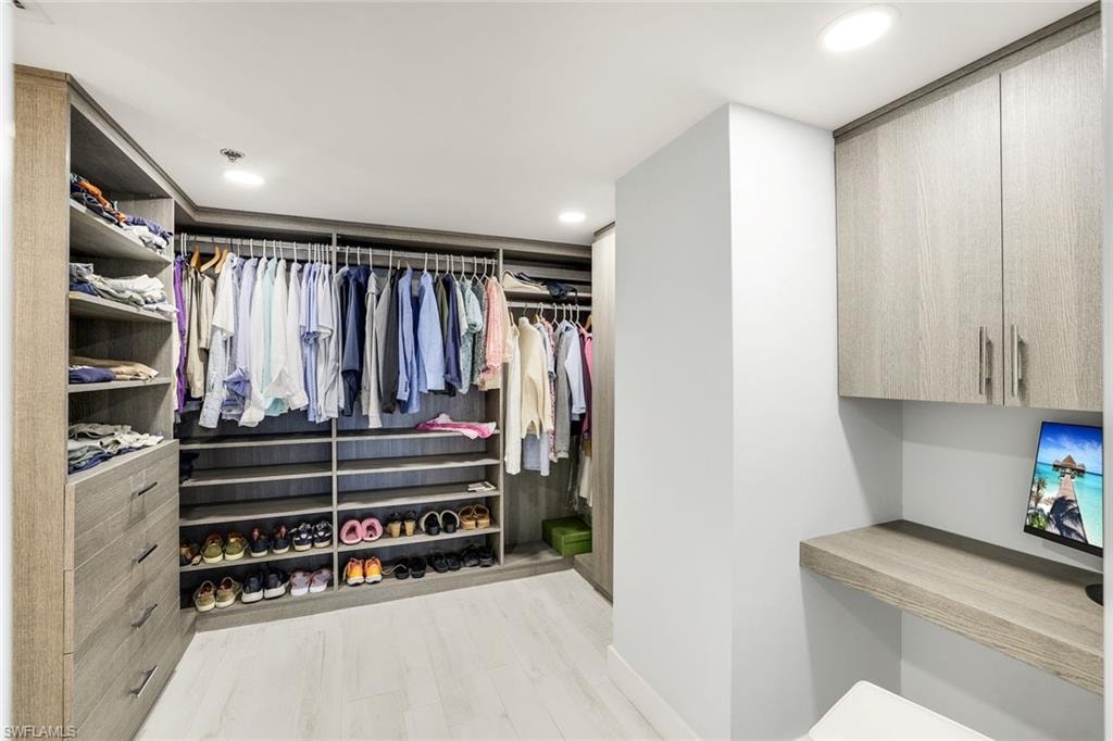 Walk in closet featuring light wood finished floors