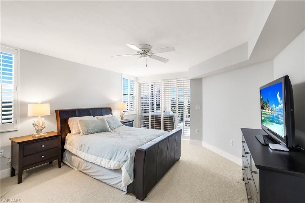 Bedroom featuring ceiling fan, light colored carpet, and access to outside