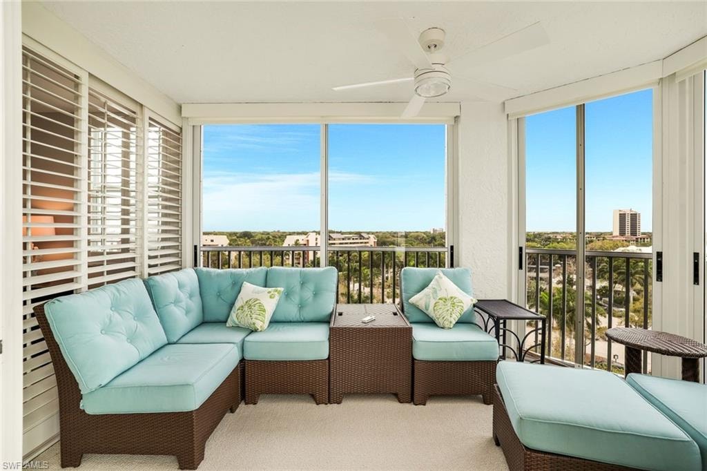 Sunroom with an outdoor lounge area, a balcony, and a ceiling fan