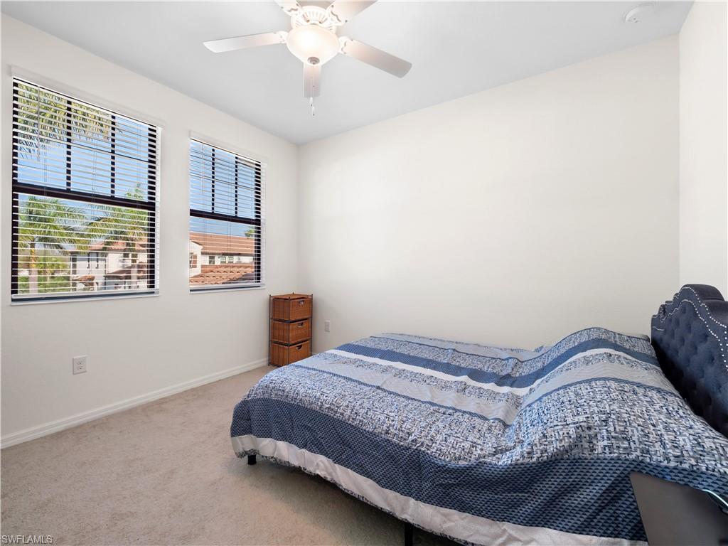 Bedroom featuring carpet and a ceiling fan