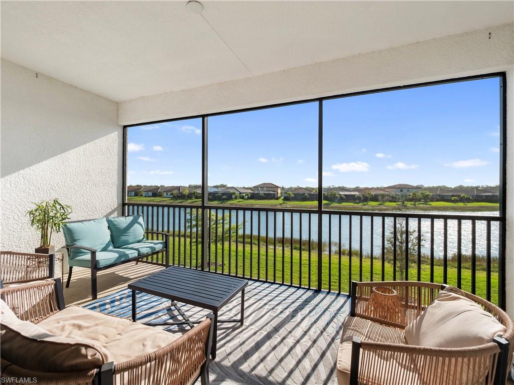 Sunroom / solarium featuring an outdoor hangout area, a residential view, a water view, and a balcony