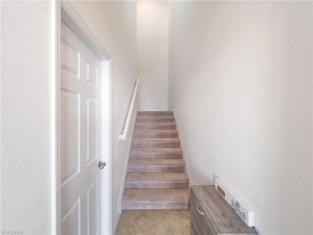 Stairway featuring tile patterned flooring
