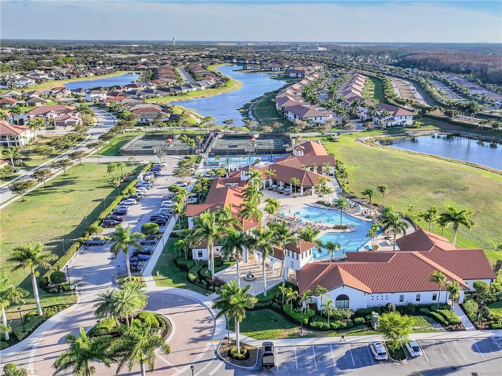 Aerial overview of property's location featuring a large body of water and nearby suburban area