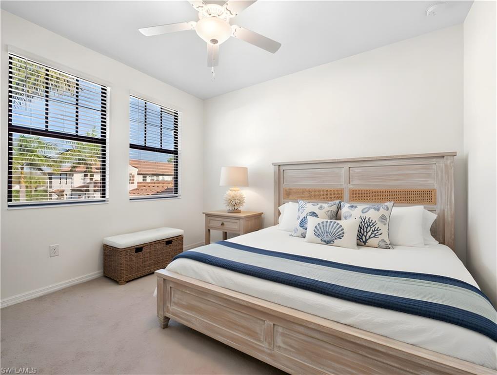 Bedroom featuring ceiling fan and light colored carpet