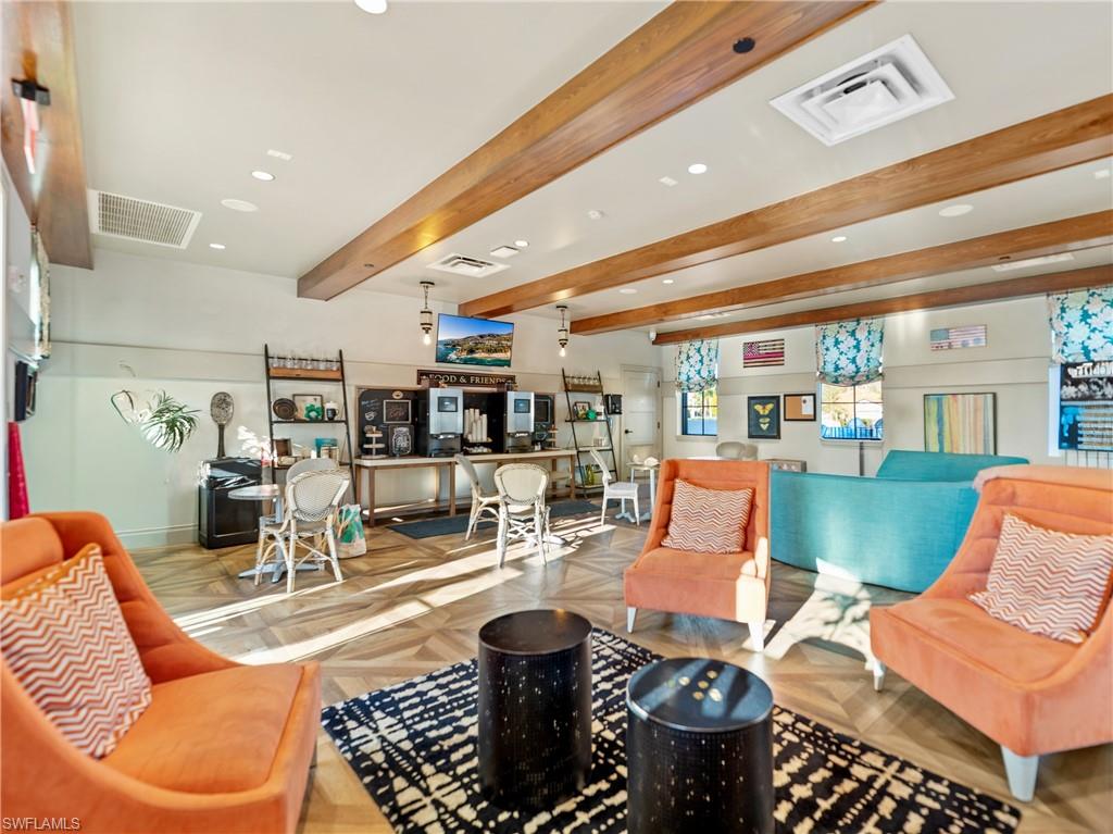 Building lobby featuring beam ceiling and recessed lighting